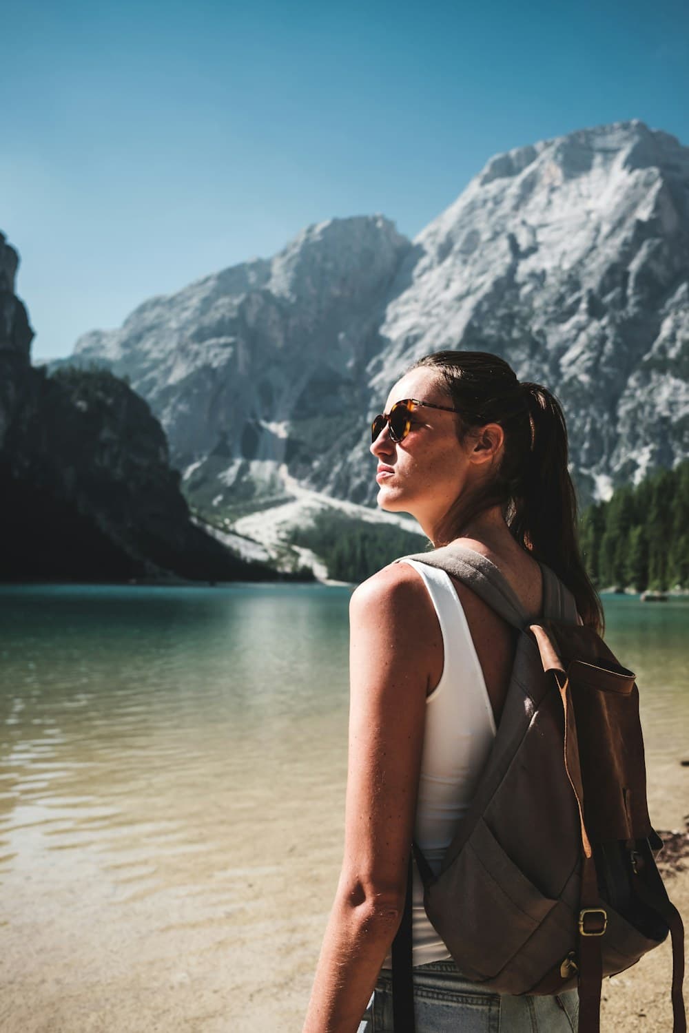 Traveler photographed at a mountain lake
